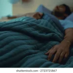 sleeping-tired-man-bed-night-260nw-2723721867